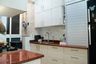 Parallel Kitchen Design with Red Granite Countertop