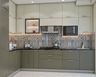 L-Shaped Kitchen Design With Granite Countertop and Patterned Backsplash