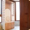 Tall Floor-Mounted Pooja Room Design with Carved Wood Accents