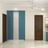 Modern 3-Door Swing Wardrobe Design with Blue and White Panels