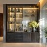 Glass and dark wood crockery unit with soft backlighting and elegant display shelves