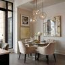 Dining Room Design with Plush Seating and Round Glass Table