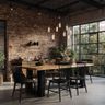 Dining room with brick wall, Edison bulbs, and wooden table with black chairs