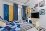 Kids Bedroom Design with Blue-Yellow Wardrobes and Themed Bedding