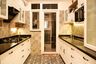 Parallel Kitchen Design in Off White with Granite Countertop