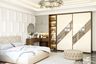 Master Bedroom Design with Diamond Headboard and Reflective Wardrobe Panels