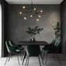 Black Marble Dining Room Design with Green Velvet Chairs