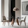 Dining Room Design with Round Glass Table and Leather Chairs