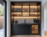 Walnut Home Bar Design with Wine Cooler and Display Shelves