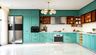 L-Shaped Kitchen Design in Mint Turquoise with Glass Cabinets