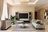 Living Room Design with Beige Sofa and Round Coffee Table