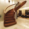 Curved Staircase Design with Rich Wooden Finish