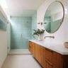 Bathroom Design With Teal and White Tiles and Floating Cabinet and Drawer Vanity