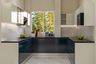 Blue and White U-Shaped Kitchen Design with Granite Countertop and Corner Units