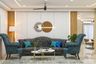 Living Room Design with Tufted Grey Sofa and Teal Accent Chairs
