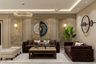 Contemporary Living Room Design with Storage Ottomans and Peacock Wall Art