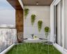 6X9 Ft Tropical Balcony Design With Grass Flooring - Livspace