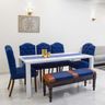 7-Seater Dining Room With Blue Upholstered Chairs And A White Tabletop - Livspace