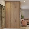 3-Door Swing Wardrobe Design With Brass Handles - Livspace