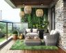 Contemporary balcony design with stone wall, turf grass and plastic seaters - Livspace