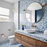 Modern bathroom with blue and white tiles and suede vanity - Livspace