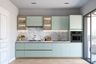 Contemporary kitchen with mint green cabinets