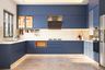 U-shaped kitchen design with blue cabinets