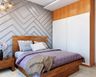 Modern Master Bedroom Design with Grey Accent Wall, Wooden Bed, and 3D Wall Panelling - Livspace
