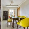 Dining Room Design With 4 Yellow Chairs, Wooden Table, Wooden Integrated Mandir Unit And Storage - Livspace