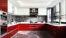 U-shaped kitchen design with red cabinets