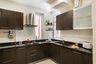 Dark Wood L-Shaped Modular Kitchen Design With Glossy Black Countertop And White 3D Backsplash - Livspace