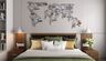 Black world map metal work in a modern style, perfect for bedrooms, offering a unique way to display memories from trips. Customizable to suit your space. - Livspace