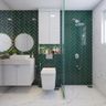 Luxurious dark green herringbone wall tiles adding sophistication to the bathroom. - Livspace