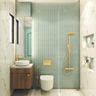 Refreshing light teal blue rhombus tiles creating a serene atmosphere in the bathroom. - Livspace