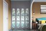 4-door floor-to-ceiling swing wardrobe design in dove grey and Mosaico Romano color - Livspace