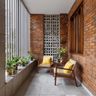 Industrial Balcony Design with Brick Wall and Concrete Flooring