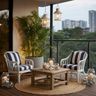 Coastal Balcony Design with Tall Palm Tree and Striped Chairs