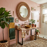 Scandinavian Bathroom Design with Light Pink Tiles and Woven Round Mirror