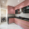 L-Shaped Kitchen Design with High Gloss Cabinets and Granite Countertops