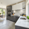 L Shaped Kitchen Design with Slate and Glossy White Cabinets