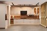 L-Shaped Kitchen Design with Cream Cabinets and Geometric Backsplash