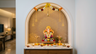 Walnut Bronze Contemporary Pooja Room Design with Textured Gold Mandala Motif Backdrop