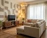 Mid-Century Modern TV Unit Design with Slatted Console and Geometric Panels