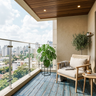 Compact Balcony Design with Woven Cane Armchair and Lighting