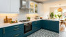 L-Shaped Kitchen Design with Blue and White Cabinets and Patterned Floor Tiles