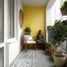 Contemporary Balcony Design with Mustard Wall and Buddha Decor