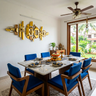 Mid-Century Modern Dining Room Design with Marble Table and Blue Chairs
