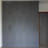 Grey Classic Sliding Wardrobe Design with Textured Rounded Panel Doors