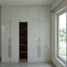 White and Walnut Modern Swing Wardrobe Design with Central Open Display Niche