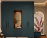 Green Swing Wardrobe Design with Integrated Dresser